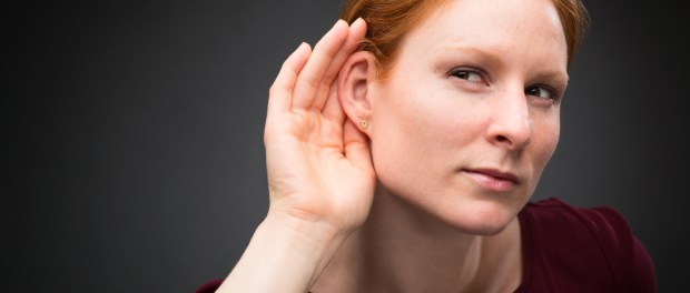 Curious Woman Listens to Rumors